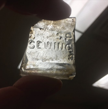 piece of glass that says sewing