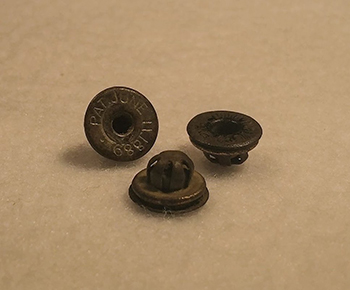 three metal buttons